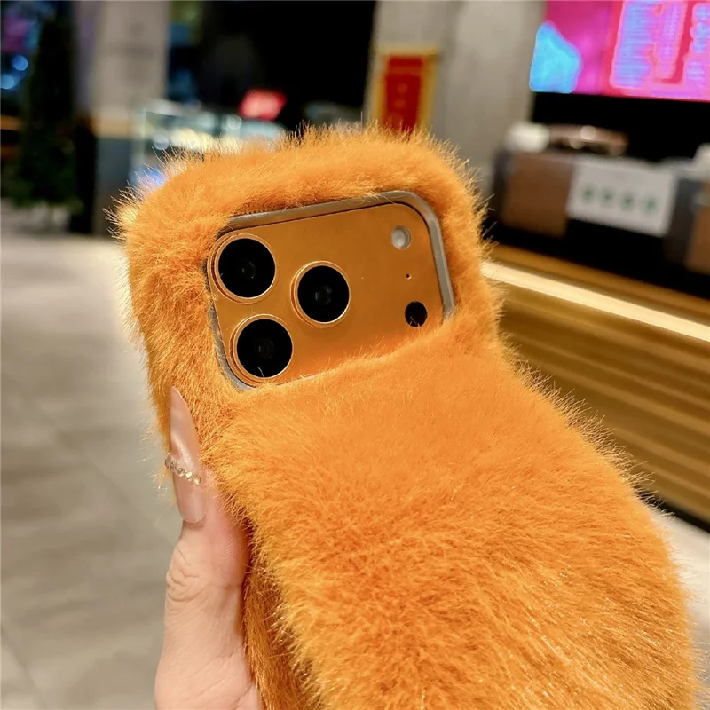 For iPhone 17 Pro Max Solid Color Fluffy Phone Case Winter Warm Hand Strap TPU Cover - Orange
