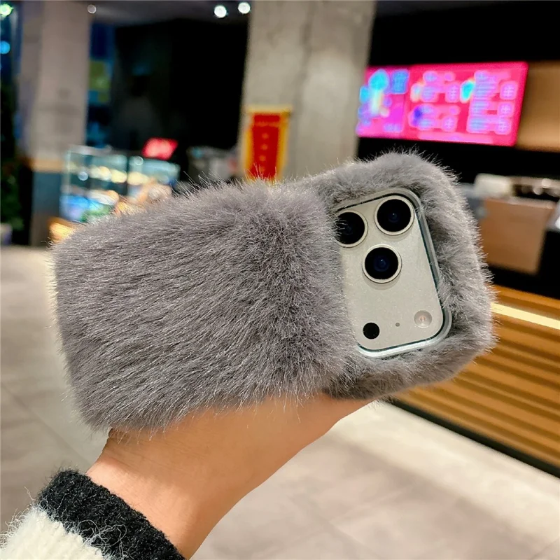 For iPhone 17 Pro Solid Color Fluffy Phone Case Winter Warm Hand Strap TPU Cover - Orange