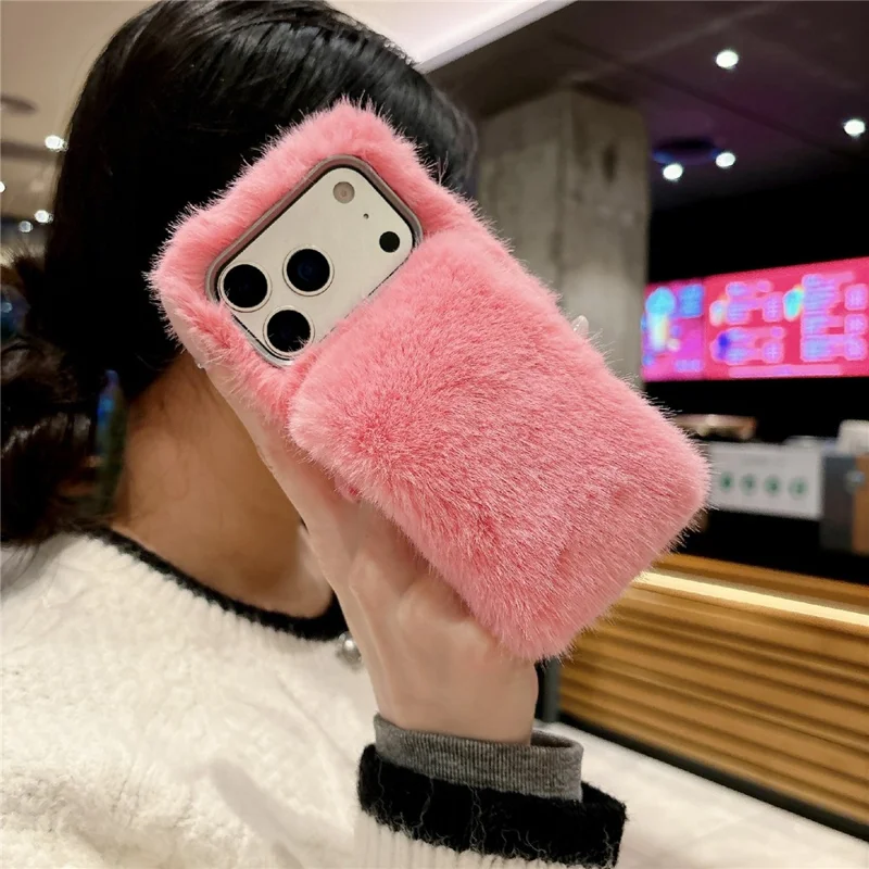 For iPhone 17 Pro Solid Color Fluffy Phone Case Winter Warm Hand Strap TPU Cover - Orange