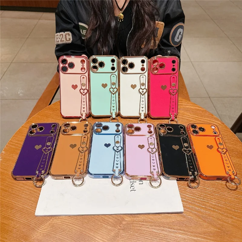 For iPhone 17 Pro Max Case Wristband Kickstand Electroplated Love Heart TPU Phone Cover Finger Holder - Orange