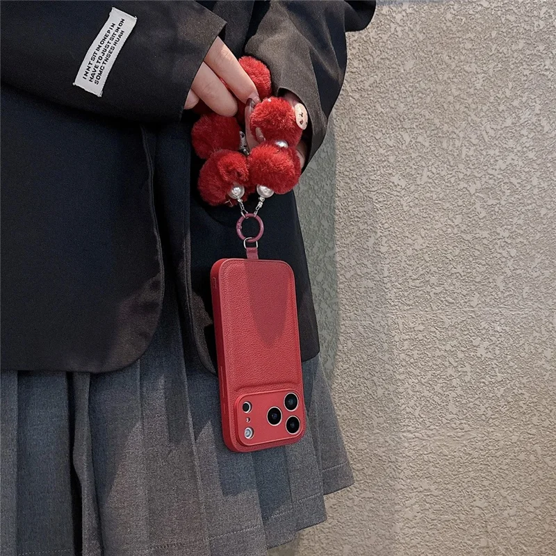 For iPhone 17 Pro Max Case TPU PU Leather PC Anti-drop Phone Back Cover with Wrist Strap - Red Plush Circle