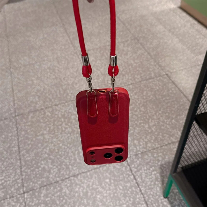For iPhone 17 Pro Case TPU PU Leather PC Anti-drop Phone Back Cover with Wrist Strap - Red Leather Strip