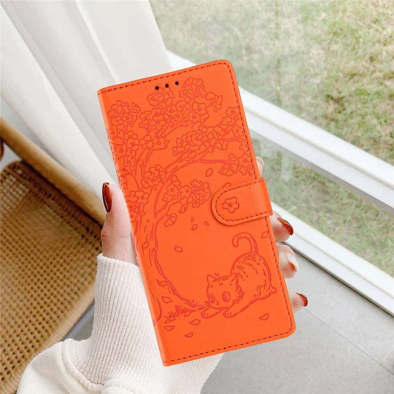 For Sony Xperia 10 VII Stand Case Tree-and-Cat Pattern PU Leather Wallet Protective Phone Cover with Wrist Strap - Orange