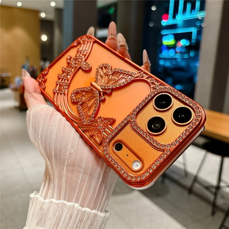 For iPhone 17 Pro Case Vlinder Strass 3D Reliëf Holle Design TPU Stootvrije Cover - Oranje