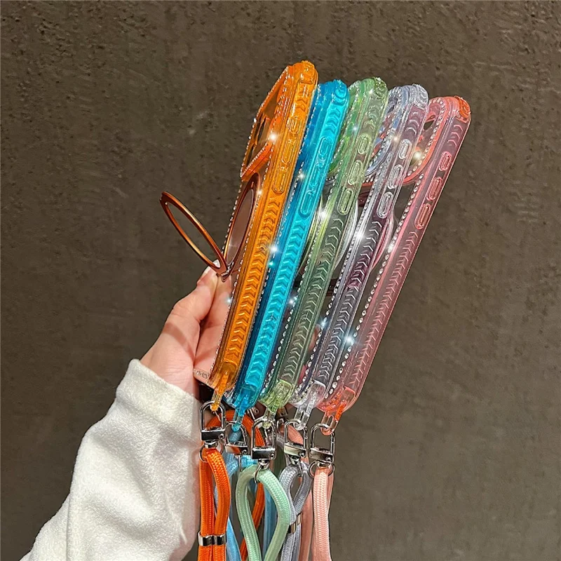 For iPhone 17 Pro Magnetic Case Ring Kickstand PC + TPU Rhinestones Decor Phone Cover with Shoulder Strap - Orange