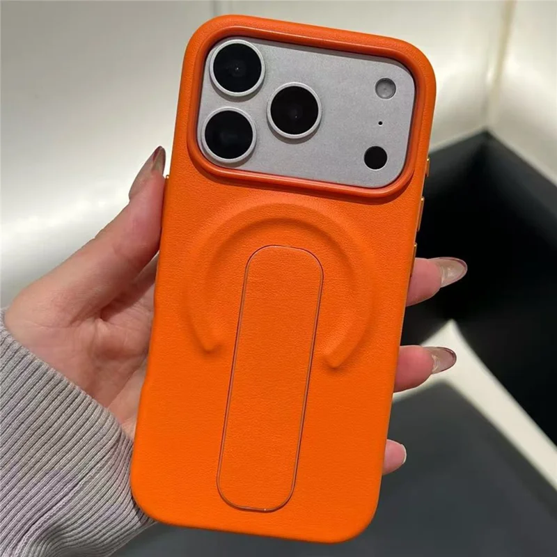 For iPhone 17 Pro Magnetic Case Finger Holder Kickstand PU Leather + PC Phone Cover - Orange