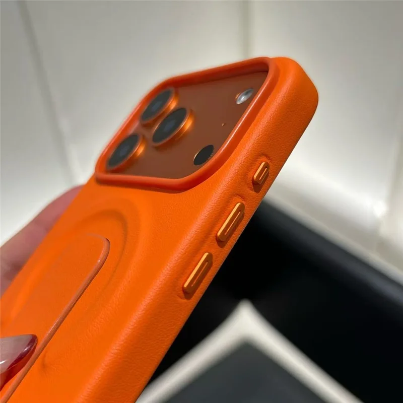For iPhone 17 Pro Magnetic Case Finger Holder Kickstand PU Leather + PC Phone Cover - Orange