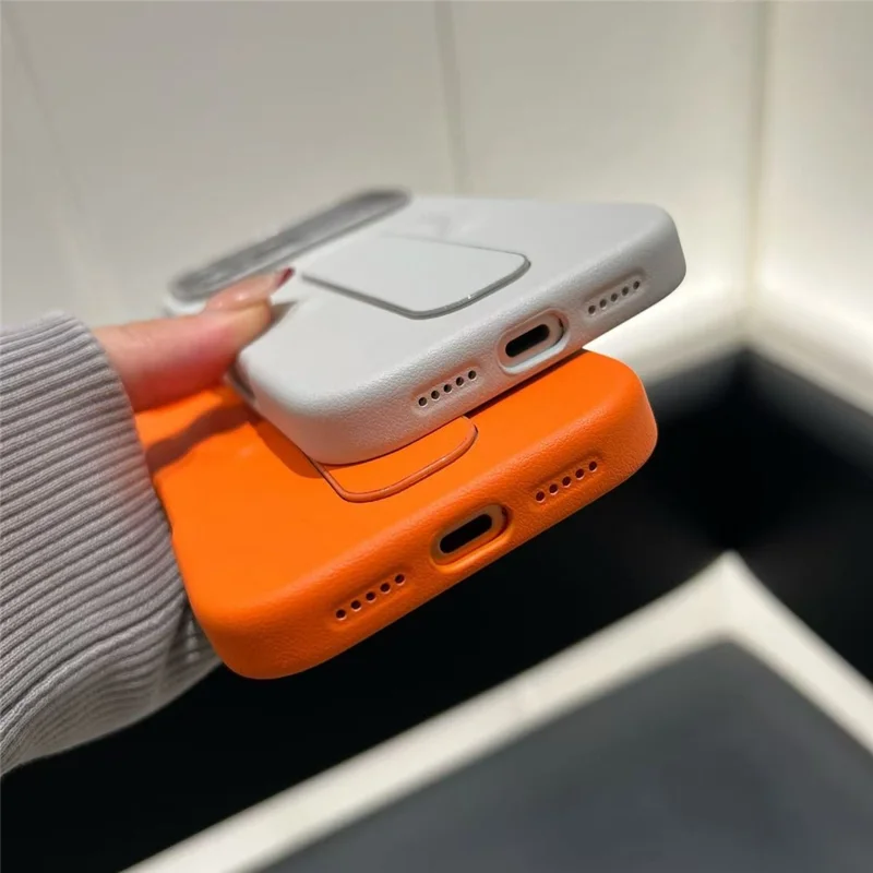 For iPhone 17 Pro Magnetic Case Finger Holder Kickstand PU Leather + PC Phone Cover - Orange