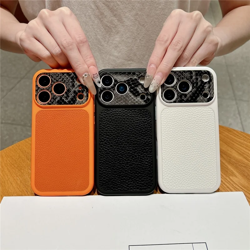 For iPhone 17 Pro TPU-hoes echt koeienleer Litchi-structuur + slangstructuur beschermhoes - Oranje