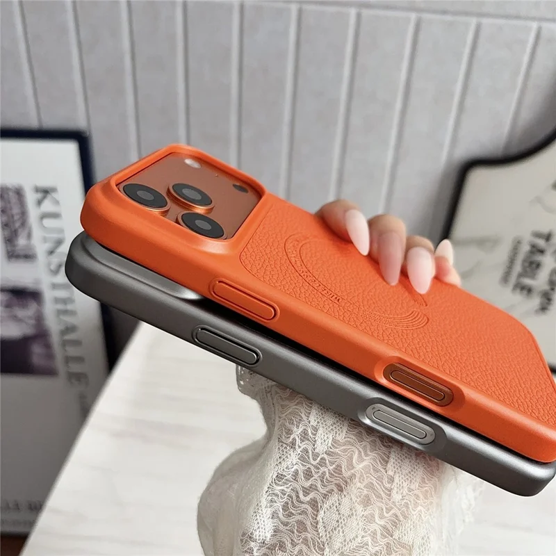 For iPhone 17 Pro Magnetic Case Litchi Texture PU Leather Coated PC + TPU Phone Back Cover - Orange