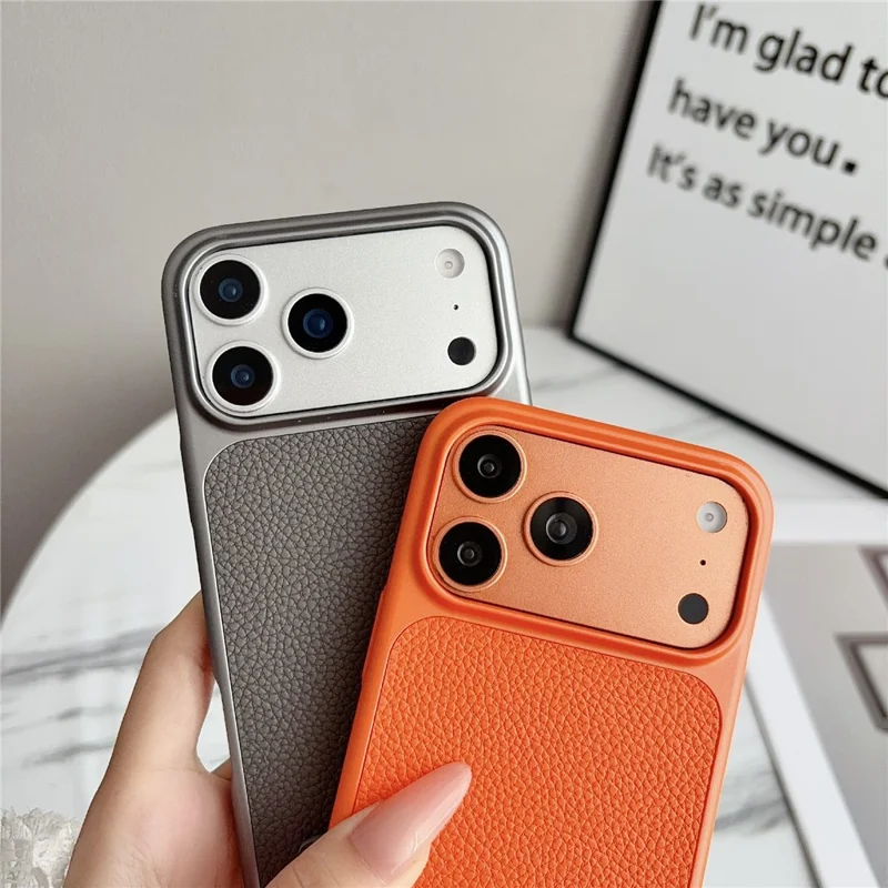 Voor iPhone 17 Pro hoesje Metaalverf Litchi-structuur PU-leer telefoon achterkant met polsbandje - Oranje