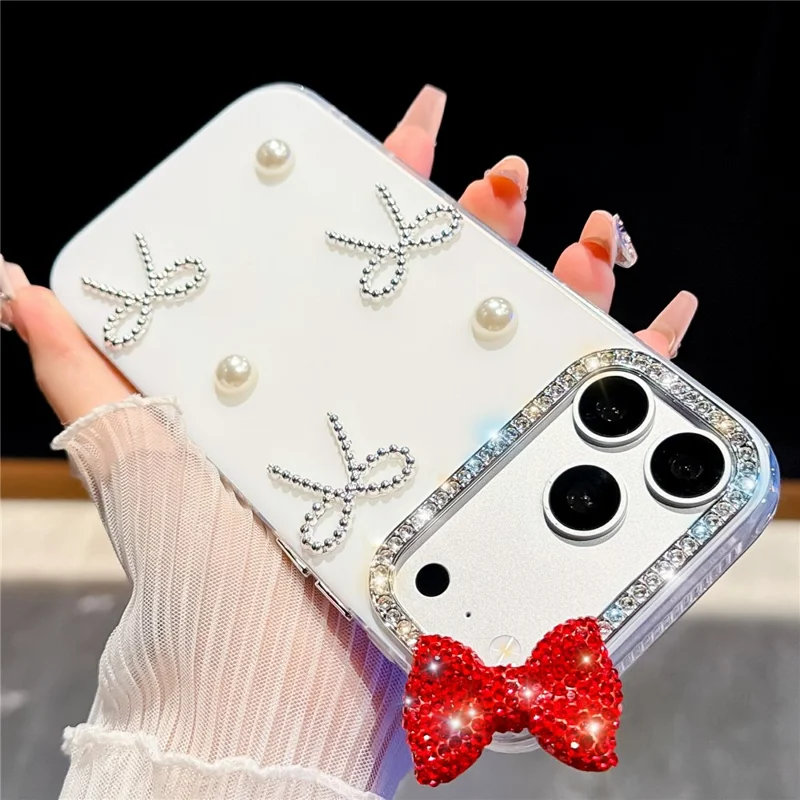 For iPhone 18 Pro / 17 Pro Case Pearl Bow Decor PC + TPU IMD Phone Cover with Rhinestone Camera Ring - Pearl White