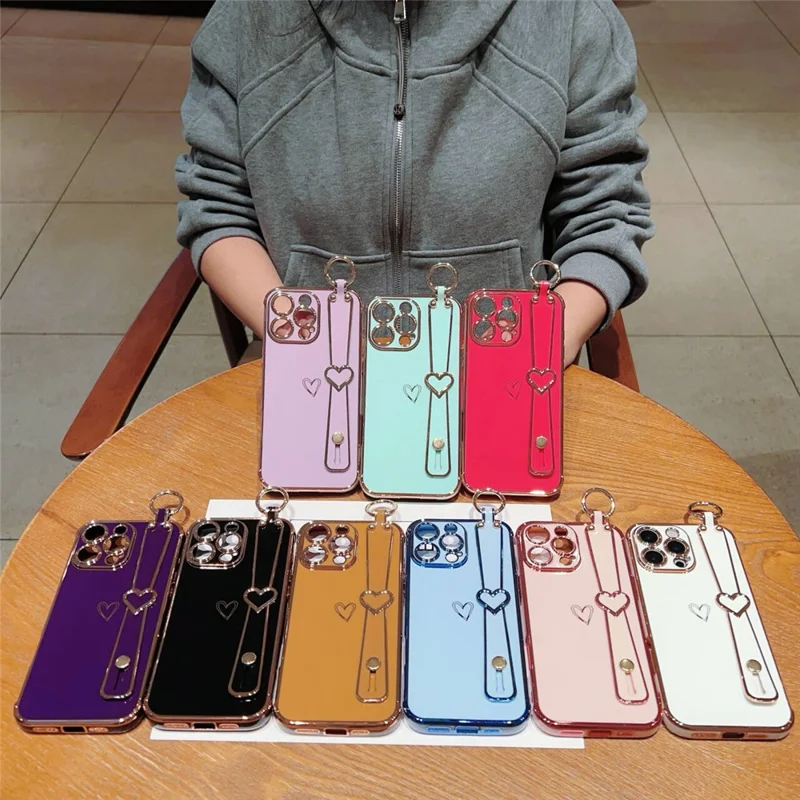 For iPhone 16 Pro Max Case Electroplated Heart Pattern TPU Phone Back Cover with Wristband Kickstand - Ivory White