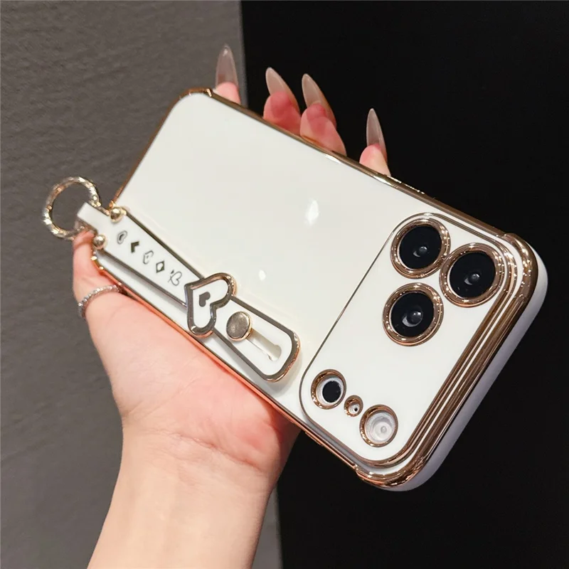 For iPhone 17 Pro Max Case Heart Wristband Kickstand Electroplated TPU Phone Cover - Ivory White