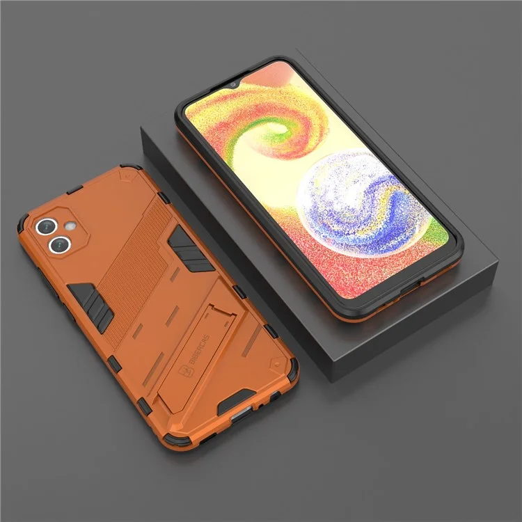 Para Samsung Galaxy A04e 4G / F04 4G / M04 4G Case de Kickstand a Prueba de Golpes Soft TPU PC Duro PC Hard-fall Cubierta de Teléfono Protectora - Naranja