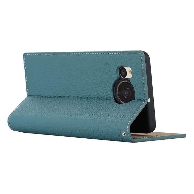 Pour Sharp Aquos Sense 7 Plus Stand Design Téléphone Portable Couvercle Téléphone Portable Anti-Chute Texture Litchi Véritable Étui en Cuir Portefeuille avec Sangle à Main - Bleu Bébé