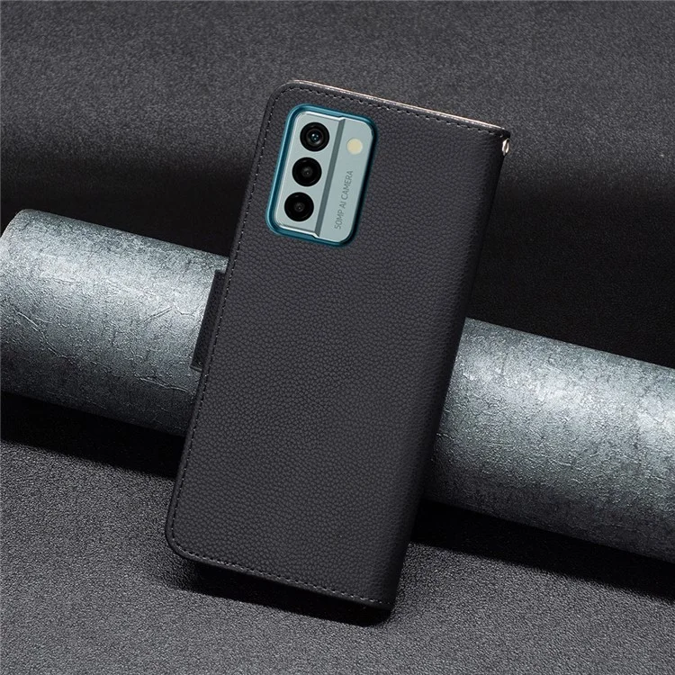 Pour Nokia G22 Solid Color PU Leather Wallet Cover Litchi Texture Flip Stand Phone Case with Strap - Noir