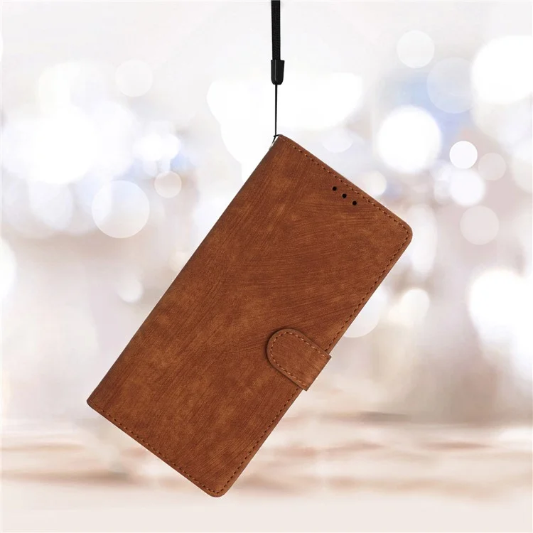 Funda de cuero con textura de piel para iPhone 14 Pro Max, de color sólido, anti-caída y con soporte - Marrón
