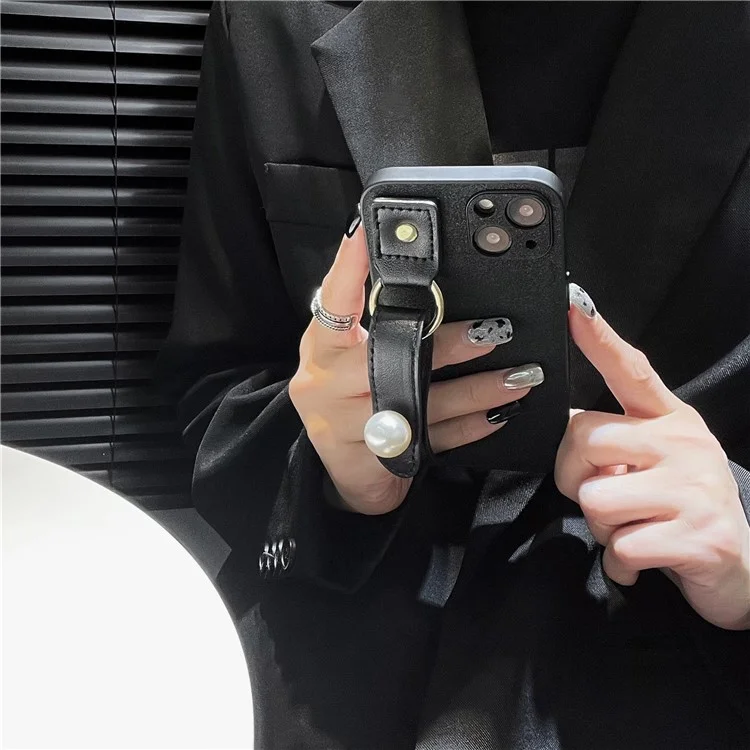 Funda de teléfono de cuero de poliuretano + TPU para iPhone 14 Plus, pulsera con adorno de perlas, protección contra caídas, carcasa negra para teléfono