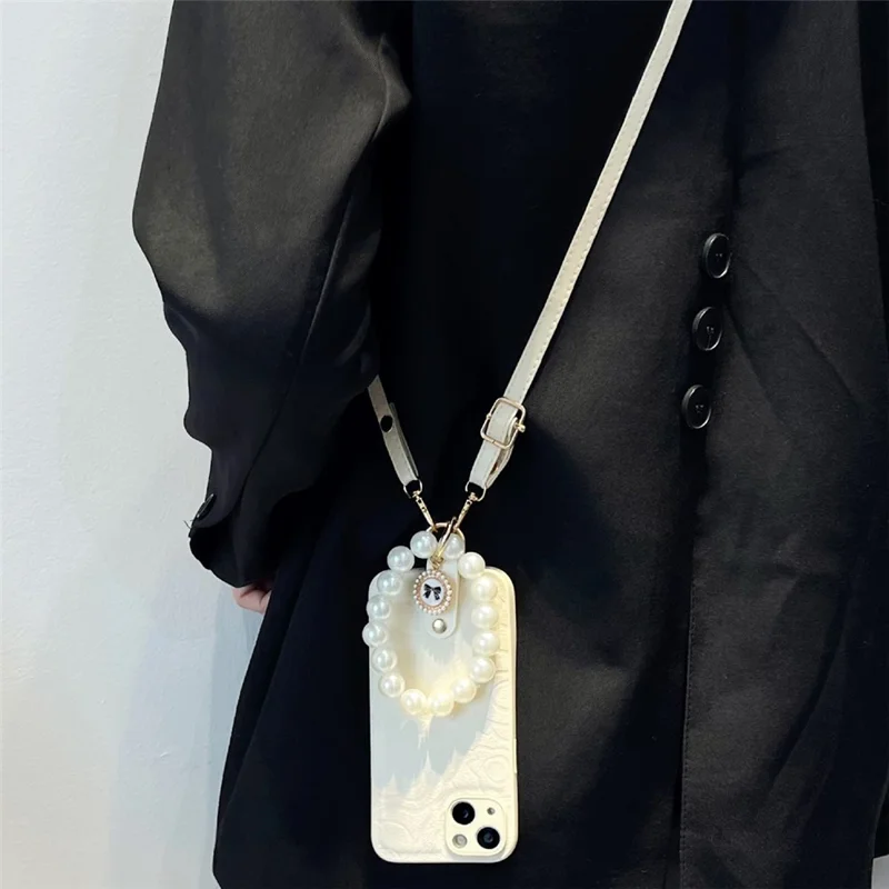 For iPhone 14 Anti-Scratch Cover Camellia Pattern Pearl Chain TPU+PU Leather Phone Case with Shoulder Strap