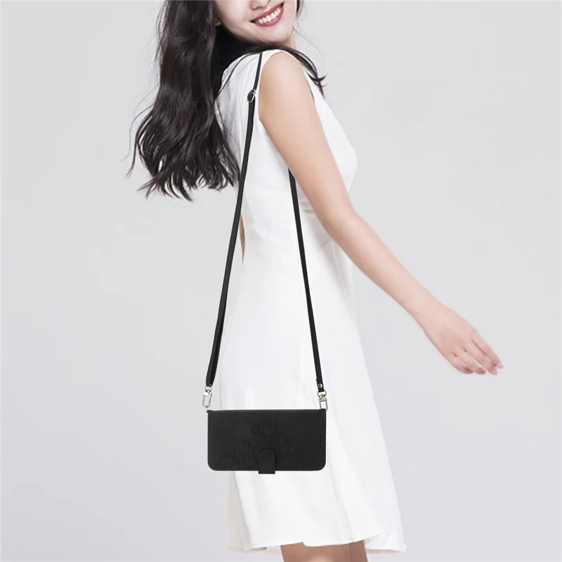 For iPhone 15 PU Leather Wallet Case Imprinted Flower Stand Phone Cover with Wrist Strap + Shoulder Strap - Black