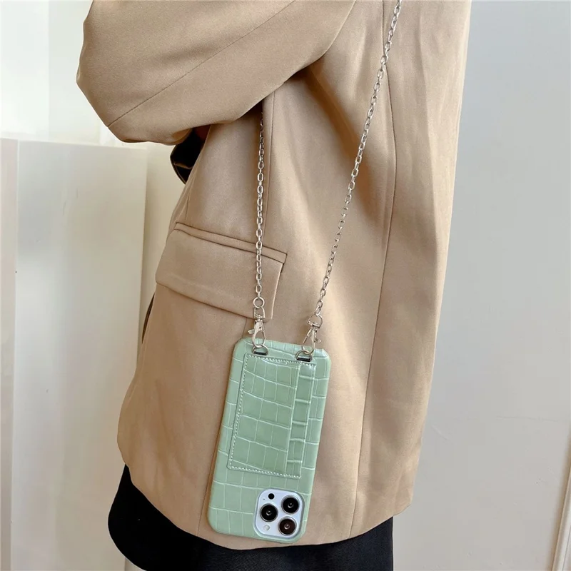 Für iPhone 15 stoßfeste Hülle mit Krokodiltextur PU+PC Handyhülle mit 2 Kartenfächern Anti-Drop Phone Shell mit Riemen - Schwarz