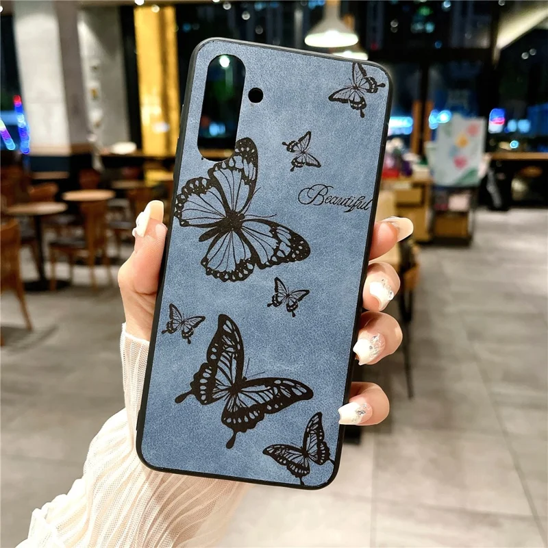 For Samsung Galaxy A04s 4G (164.7 x 76.7 x 9.1 mm) / A13 5G Case Flower Pattern Leather Back Phone Cover - Blue / Butterfly