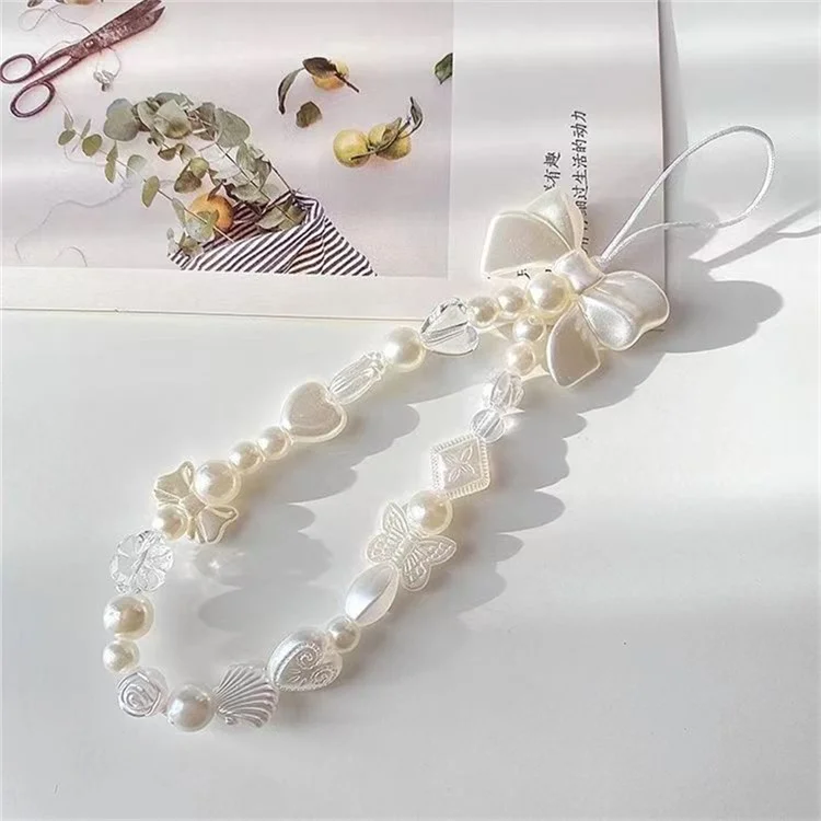 Bracelet de téléphone à perles, dragonne avec charms papillons, cœurs et coquillages