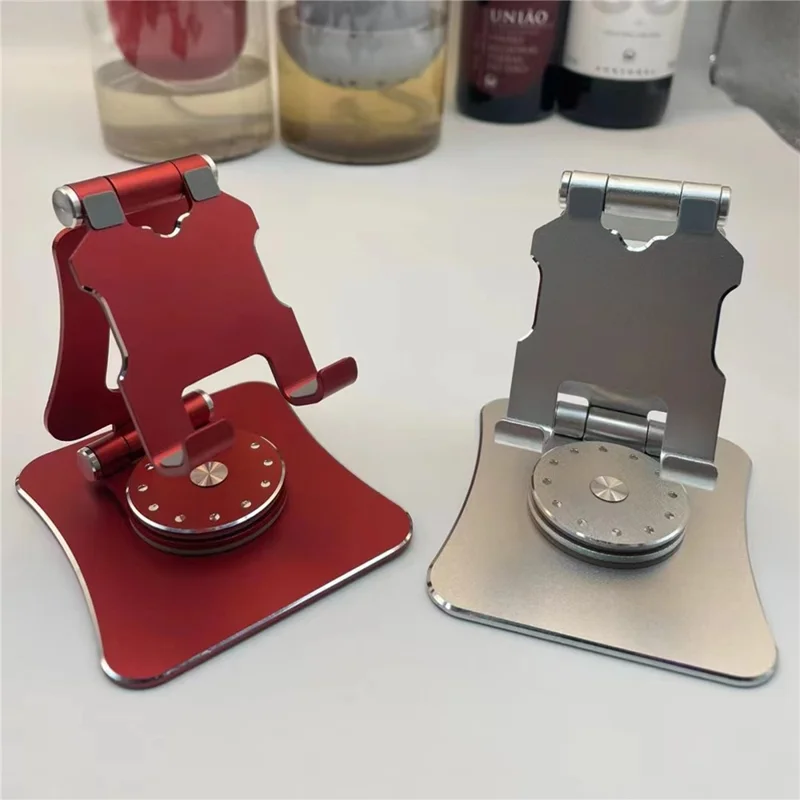 G63 Desktop Mini Folding Cell Phone Stand for iPhone 16 / 16 Plus / 16 Pro / 16 Pro Max 360-Degree Rotating Portable Metal Phone Holder - Red