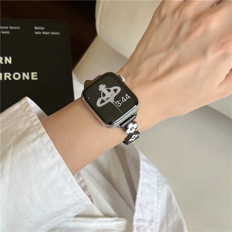 Für Apple Watch 10 42mm / 9 8 7 41mm / SE (2023) SE (2022) SE 6 5 4 40mm / 3 2 1 38mm Lederarmband mit Blumenförmigen Verbindern - Schwarz / Weiß Schwarz