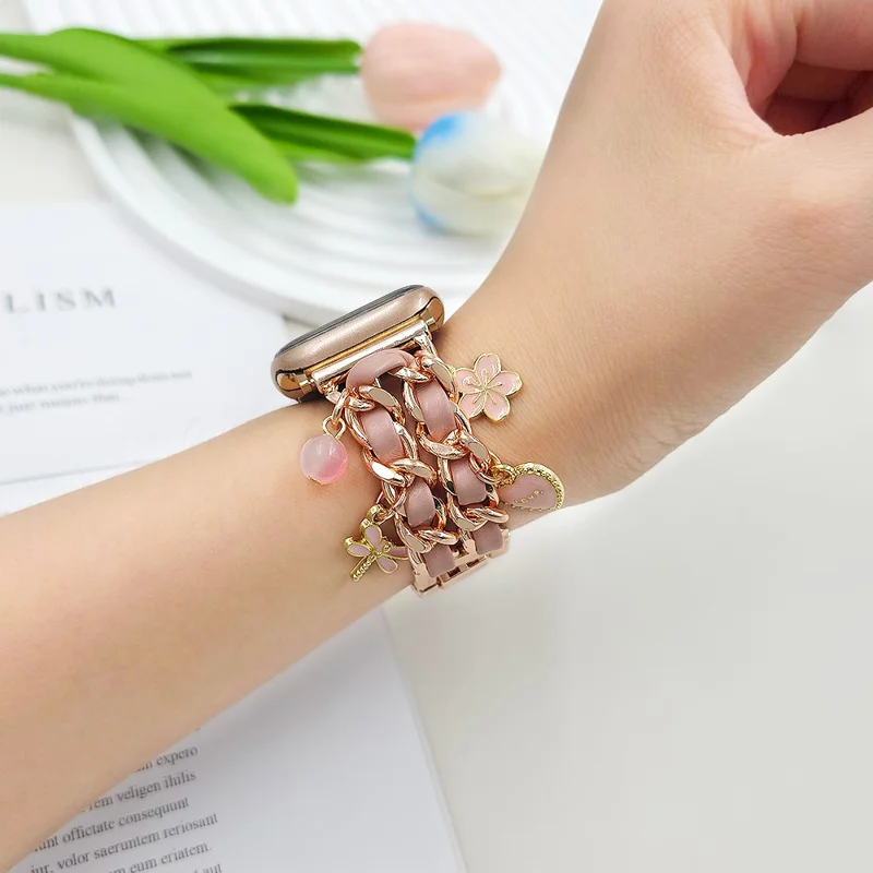 Watch Strap for Apple Watch Series 11 10 42mm / 9 8 7 41mm / SE3 SE2 SE 6 5 4 40mm / 3 2 1 38mm Alloy+Leather Band with Butterfly and Flower Pendant - Rose Gold