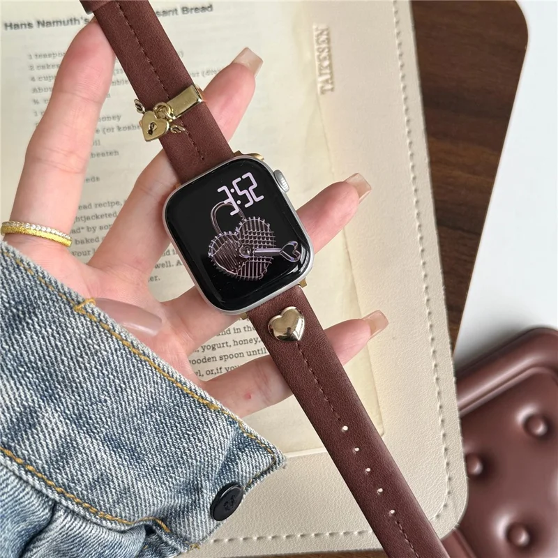 Wrist Strap for Apple Watch Series 10 9 8 7 SE 6 5 4 3 2 1 42mm 41mm 40mm 38mm Heart Pendant Leather Watch Band - Coffee / Gold Buckle