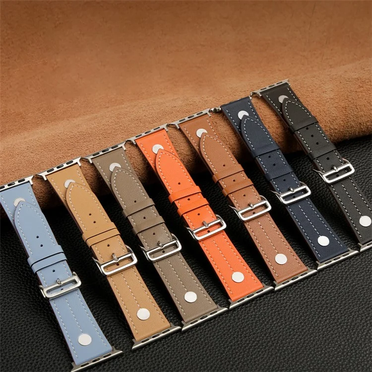 Pour Apple Watch Series 10 46 mm / Ultra 2 Ultra 49 mm / Series 9 8 7 45 mm / 6 5 4 SE (2023) SE (2022) SE 44 mm / 3 2 1 42 mm Véritable bracelet en cuir de vache Rivet Decor Strap - Marron