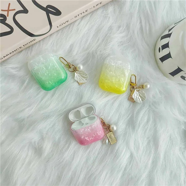 Custodia per cuffie Earphone per Apple AirPods con custodia di ricarica (2016) / (2019) / AirPods con custodia di ricarica wireless (2019), custodia in TPU a grana di conchiglia sfumata con pendente - Arancione