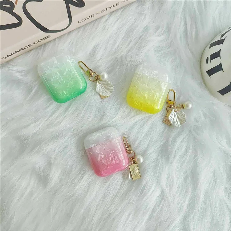 Custodia per cuffie Earphone per Apple AirPods con custodia di ricarica (2016) / (2019) / AirPods con custodia di ricarica wireless (2019), custodia in TPU a grana di conchiglia sfumata con pendente - Arancione