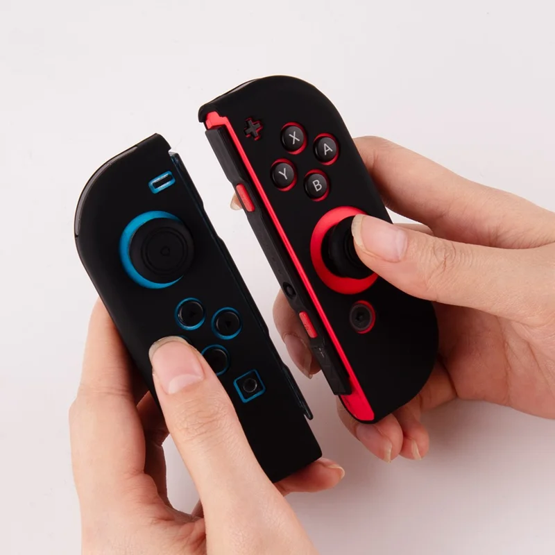 غطاء سيليكون لوحدة تحكم نينتندو سويتش + أغطية أصابع تحكم مانعة للانزلاق، غطاء واقي ممتص للصدمات - أسود