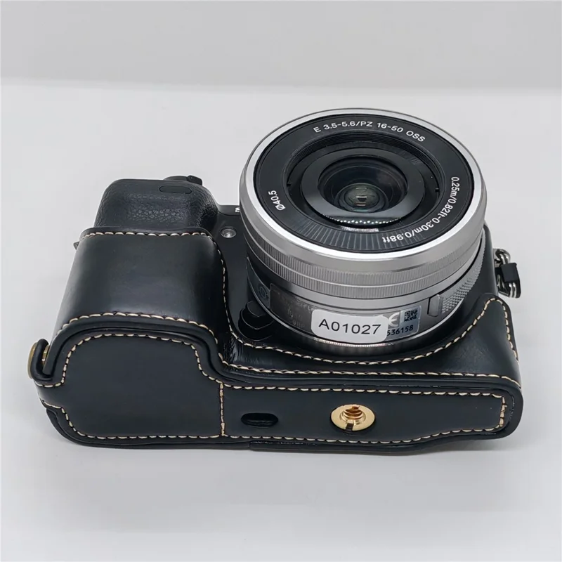 غطاء كاميرا نصف جسم لسوني NEX-7 / NEX-6 مع إمكانية الوصول إلى البطارية، غطاء سفلي من جلد البولي يوريثان - أسود