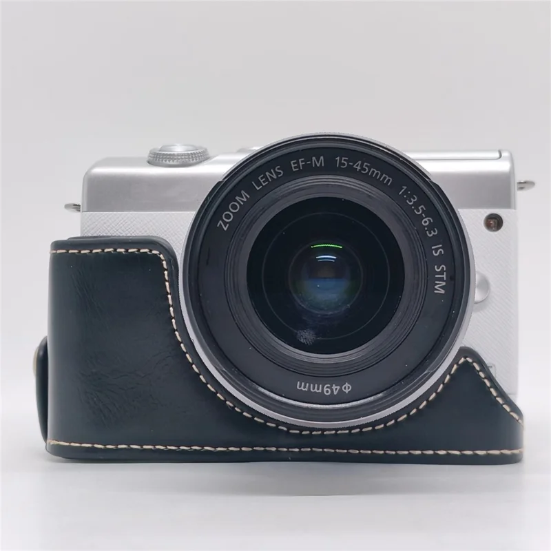 حالة الكاميرا لـ Canon EOS M10 / M100 / M200 غطاء جزئي من الجلد الصناعي مع حزام يد وفتحة قابلة للإزالة لاستبدال البطارية - أسود