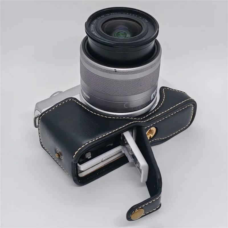 حالة الكاميرا لـ Canon EOS M10 / M100 / M200 غطاء جزئي من الجلد الصناعي مع حزام يد وفتحة قابلة للإزالة لاستبدال البطارية - أسود