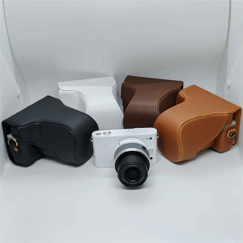 Étui en cuir pour appareil photo Nikon J1 / J2, housse demi-enveloppante avec bandoulière, protection en cuir PU - Café