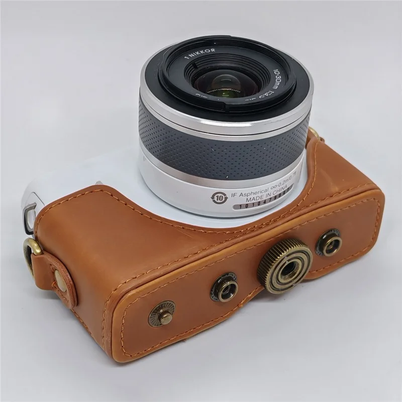 Étui en cuir pour appareil photo Nikon J1 / J2, housse demi-enveloppante avec bandoulière, protection en cuir PU - Café