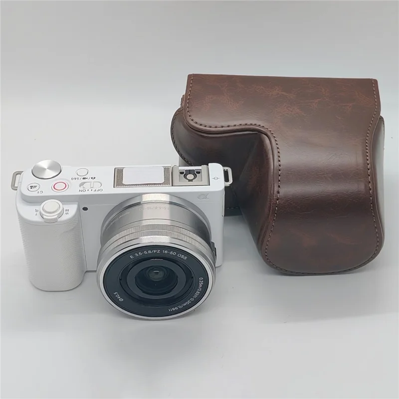 For Sony ZV-E10 Camera Case PU Leather Battery Access Opening Protective Cover with Shoulder Strap - Coffee