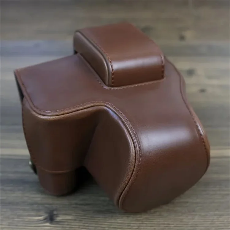 PU Leather Camera Case Bag for Canon EOS R10, Battery Opening Design Protective Cover with Lens Pouch and Strap - Coffee