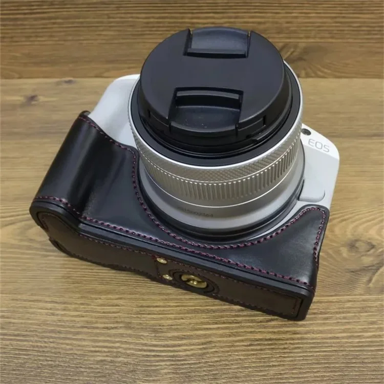 For Canon EOS R50 / R100 PU Leather Bottom Case Half Body Camera Cover with Wrist Strap - Black