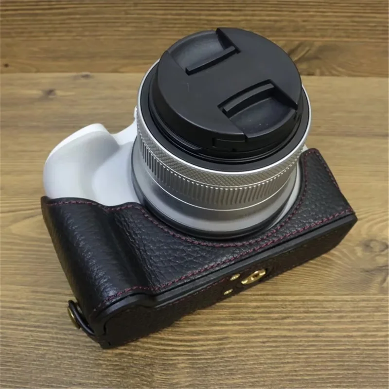 For Canon EOS R50 / R100 Genuine Cow Leather Camera Bottom Case Anti-drop Cover with Wrist Strap - Black