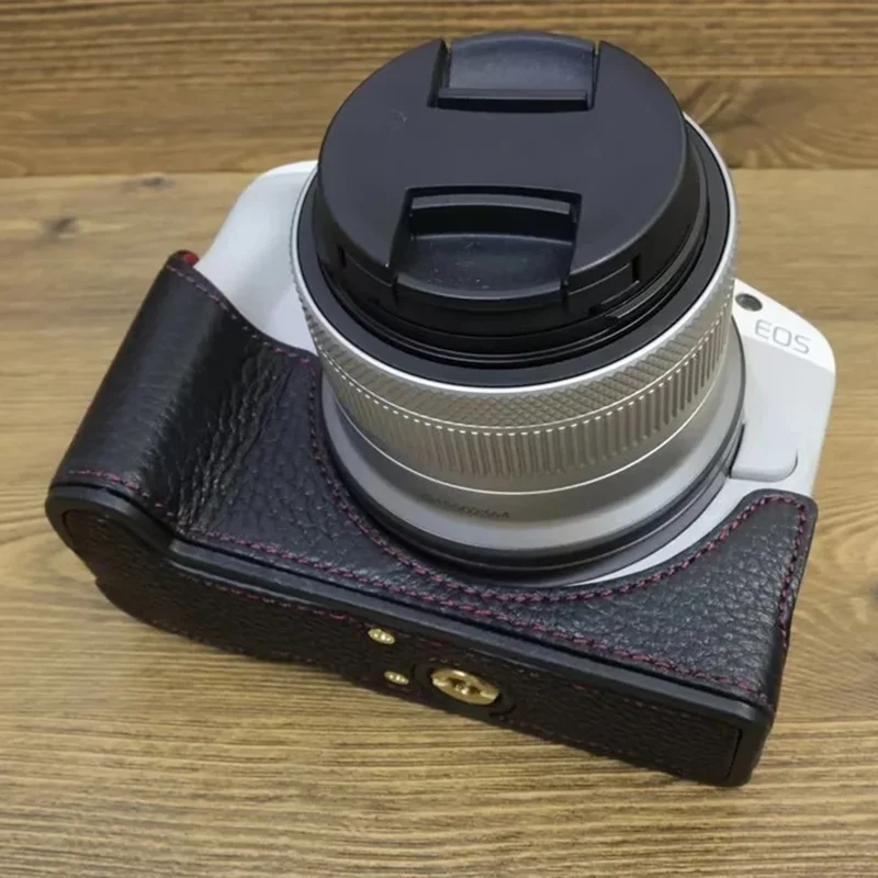 For Canon EOS R50 / R100 Genuine Cow Leather Camera Bottom Case Anti-drop Cover with Wrist Strap - Black
