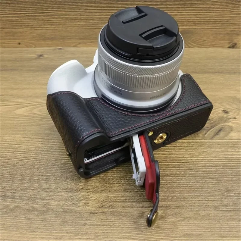 For Canon EOS R50 / R100 Genuine Cow Leather Camera Bottom Case Anti-drop Cover with Wrist Strap - Black
