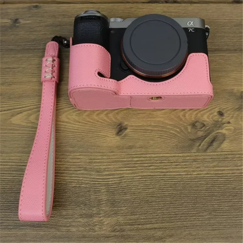 For Sony A7C II / A7CR Camera Bottom Case PU Leather Anti-Drop Half Body Cover with Wrist Strap - Pink