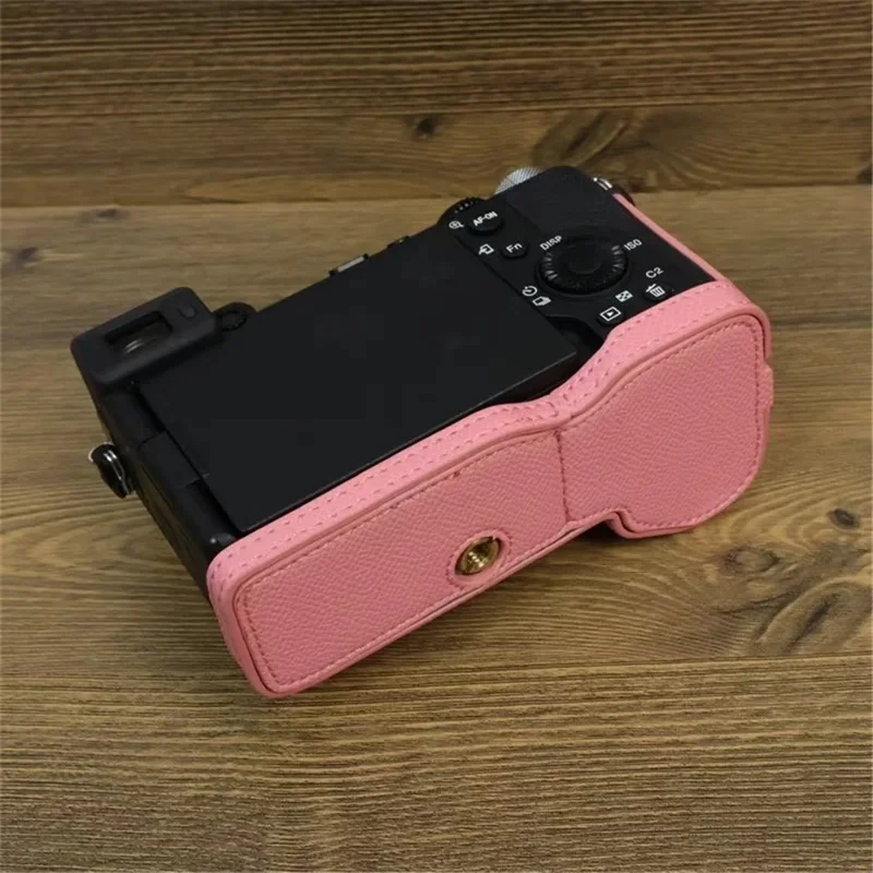For Sony A7C II / A7CR Camera Bottom Case PU Leather Anti-Drop Half Body Cover with Wrist Strap - Pink