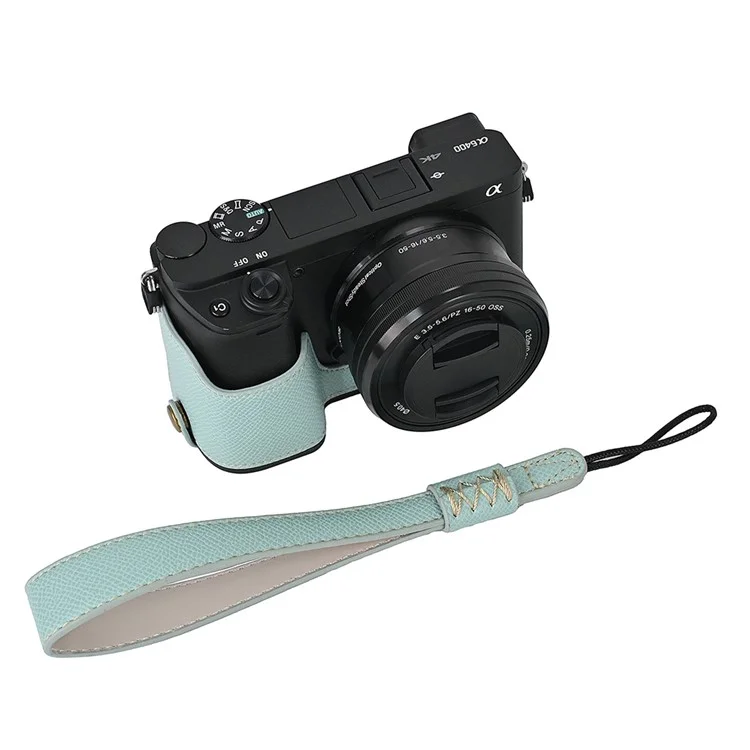 Étui pour appareil photo pour Sony A6400 / A6300 / A6100 / A6000 Conception d'ouverture de la batterie Texture de paume Cuir PU Demi-corps Étui de fond avec dragonne - Bleu bébé